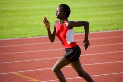 Jupiterimages/Pixland/Getty Images Sprinting is one form of cardio exercise to increase thigh size and power.