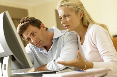 BananaStock/BananaStock/Getty Images Proactive budgeting can help protect against unmanageable debt situations.