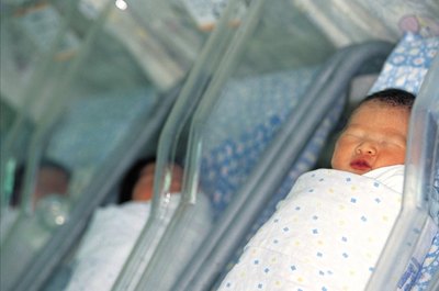 Jupiterimages/Photos.com/Getty Images Budget for baby before you bring him home from the hospital.
