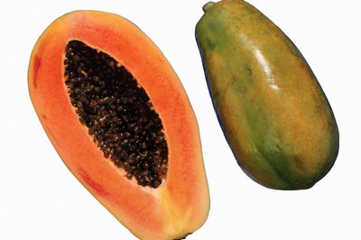 Jupiterimages/Comstock/Getty Images Papaya flesh, seeds and skin offer a range of health benefits.