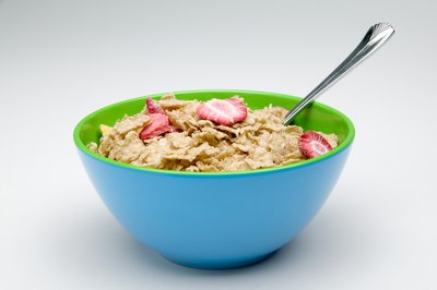 Jupiterimages/liquidlibrary/Getty Images A bowl of fortified cereal can help you meet your iron needs for the day.
