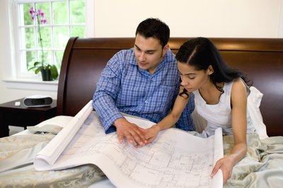 David Sacks/Lifesize/Getty Images Write specific lists of upgrades to help calculate renovation costs.