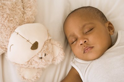 Jupiterimages/Pixland/Getty Images The postpartum period is a time to focus on your new baby, not your tummy.