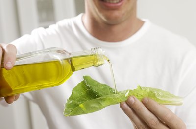 Pixland/Pixland/Getty Images Olive oil is a source of monounsaturated triglycerides containing oleic acid.