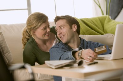 Comstock Images/Comstock/Getty Images Paying household bills can be easier with a joint account.