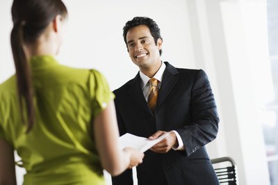 Brand X Pictures/Brand X Pictures/Getty Images A job offer letter informs the candidate that the offer is official.