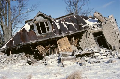 Hemera Technologies/AbleStock.com/Getty Images Living in an area of frequent natural disasters requires a larger emergency fund.