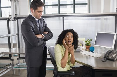 Creatas Images/Creatas/Getty Images Your boss can limit, or even ban, your cell phone use.