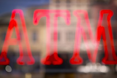 Jupiterimages/Photos.com/Getty Images Many credit unions allow you to take cash from ATMs across the country without a surcharge.