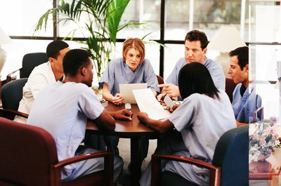NA/Photos.com/Getty Images Many internships require team meeting attendance.