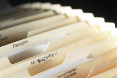 Hemera Technologies/AbleStock.com/Getty Images You pay annual mortgage insurance premiums on a monthly basis.