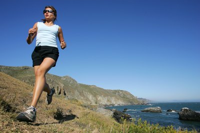 Jupiterimages/Comstock/Getty Images Running burns more calories than yoga.