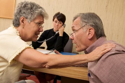 Jupiterimages/liquidlibrary/Getty Images Marriage therapists help couples evaluate destructive behavior.