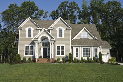 Jupiterimages/Comstock/Getty Images Real estate taxes are paid on the value of your land, house and other permanent buildings.