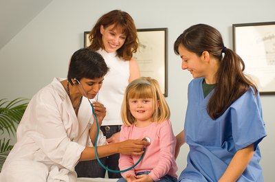 Jupiterimages/Photos.com/Getty Images Working with parents is par for the course as a pediatrician.