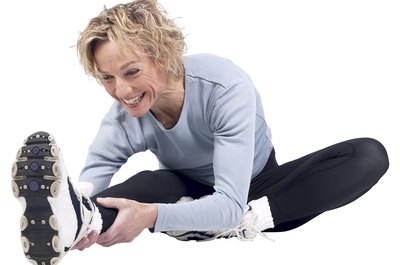 Hemera Technologies/PhotoObjects.net/Getty Images Point and flex your toes to warm up your ankles.