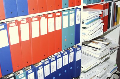 Hemera Technologies/AbleStock.com/Getty Images You could use color-coded binders to store things you need to access often.