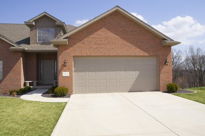 Jupiterimages/liquidlibrary/Getty Images Garages can amount to more than just a place to park the car.