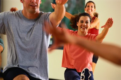 Ryan McVay/Photodisc/Getty Images Make new friends in a group exercise class.