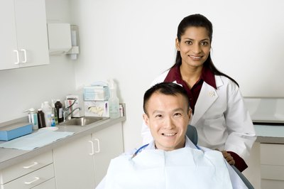 Creatas Images/Creatas/Getty Images Dentists working out of dental offices earn about $164,780 annually.