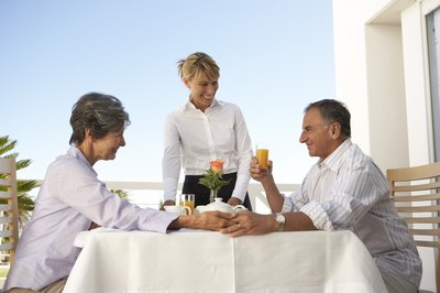 Pixland/Pixland/Getty Images Head waiters still serve customers, but also manage the floor.