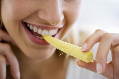 Jupiterimages/Pixland/Getty Images Eating corn is one of the best ways to get more insoluble fiber in your diet.