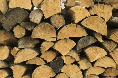 Thinkstock/Comstock/Getty Images One cord of firewood produces 25 percent more heat than 100 gallons of fuel oil.