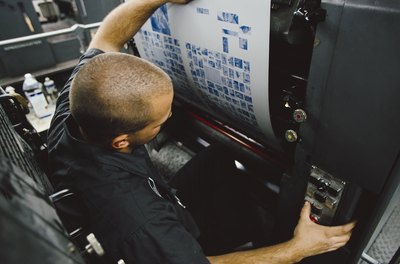 Photodisc/Photodisc/Getty Images The responsibility of catching final formatting issues falls on the prepress technician.