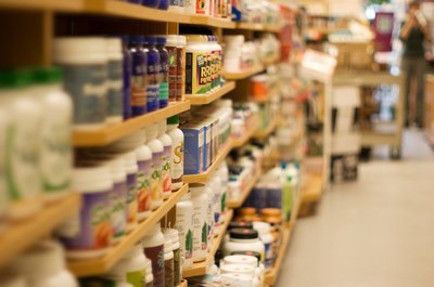 Jupiterimages/Photos.com/Getty Images Some supermarkets carry human-grade lysine that is safe for feline consumption.