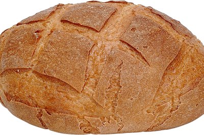 Zedcor Wholly Owned/PhotoObjects.net/Getty Images Whole-grain breads are slow-digesting carbs.