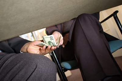 Thinkstock Images/Comstock/Getty Images Tips and gratuities are prohibited by some state and federal laws.