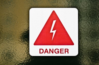 Jupiterimages/Photos.com/Getty Images Management works to minimize chemical, physical, biological and psychological hazards in the workplace.