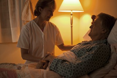Comstock Images/Comstock/Getty Images Viatical settlements offer to purchase another person's life insurance policy in exchange for the death benefit.