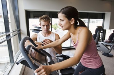 Jupiterimages/Goodshoot/Getty Images Recumbent bikes are more expensive than upright models.