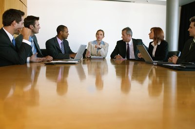 Nick White/Photodisc/Getty Images Setting realistic goals and motivating employees to reach them is the main focus of leaders