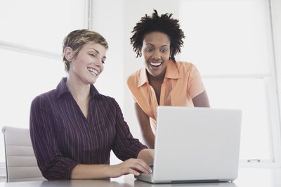 Jupiterimages, Brand X Pictures/Brand X Pictures/Getty Images A+ certificate holders help users solve computer hardware and software problems.