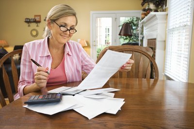 Jupiterimages/Comstock/Getty Images Refinancing a jumbo loan can reduce the amount of interest paid over the life of the loan.