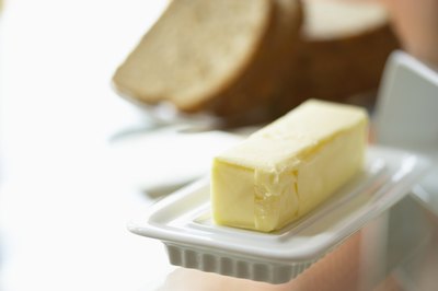 Jupiterimages/Photos.com/Getty Images Saturated fats, such as butter, may not be as harmful as trans fats.