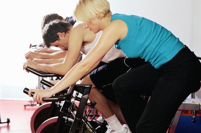Digital Vision/Digital Vision/Getty Images Many people benefit from workout classes because of the social setting.