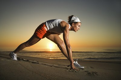 Jupiterimages/Comstock/Getty Images Do not round your back during the lunging stretches.