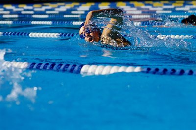 Ryan McVay/Photodisc/Getty Images Swim strokes like freestyle, for which your elbows are bent, force your triceps to lengthen.