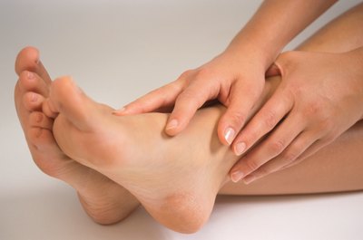 Hemera Technologies/Photos.com/Getty Images Foot cramps are common during Bikram yoga sessions.