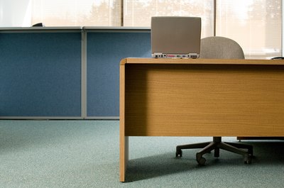 Jupiterimages/Photos.com/Getty Images Changing the layout of the workplace is one way to modify the climate.