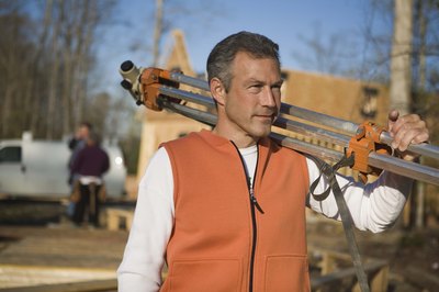 Jupiterimages/Comstock/Getty Images Subdividing your lot requires the expertise of a professional surveyor.