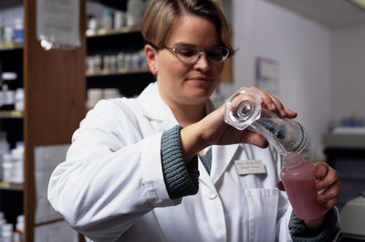 Keith Brofsky/Digital Vision/Getty Images Pharmacy techs work in retail stores, hospitals and other medical settings.