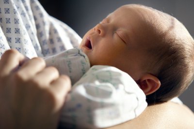 Photodisc/Photodisc/Getty Images Having a child can positively affect your income taxes.