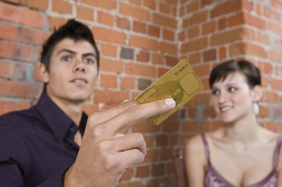 Jupiterimages/Goodshoot/Getty Images Your partner will get a card in his name.