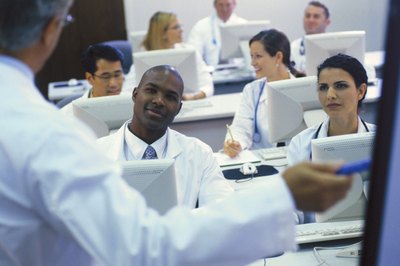 Comstock/Comstock/Getty Images After graduation, students decide whether to pursue medicine or surgery.