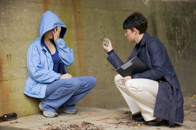 Jupiterimages/liquidlibrary/Getty Images Interviewing for a caseworker position requires answering tough questions.