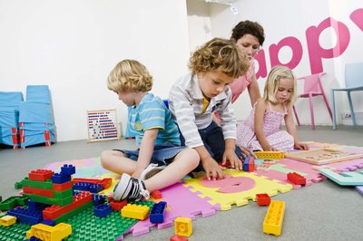 Jupiterimages/Goodshoot/Getty Images Daycare owners' earnings are proportional to the number of children they watch.
